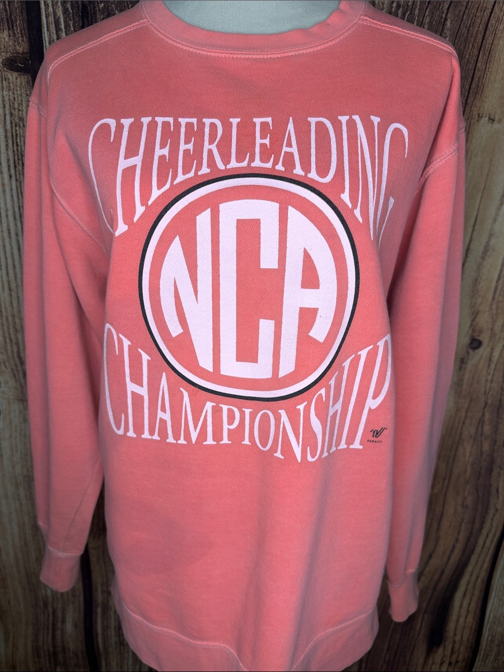 Comfort Colors Coral Crewneck Sweatshirt with NCA Cheer Graphic